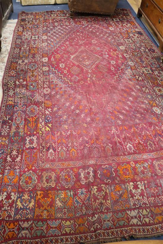 A Caucasian red ground carpet 403cm x 222cm